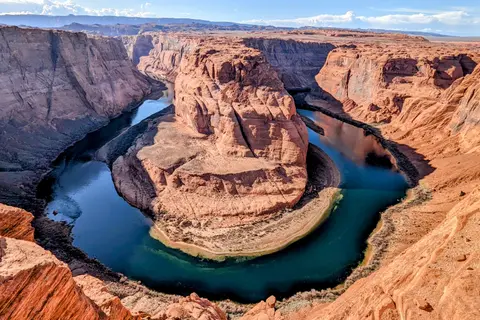 The Colorado River, which carved the canyon over millions of years